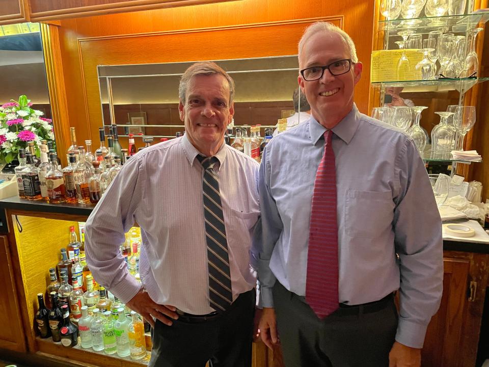 Bartenders Larry Thomas, left, and Scott Rigger, right, have been bartending at Akron's Diamond Grille for a combined 91 years.