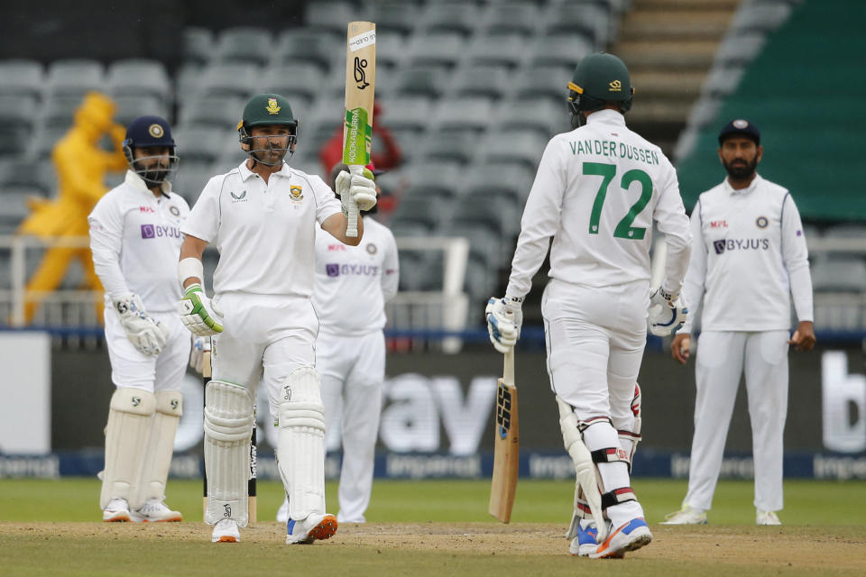 Seen here, South Africa's Dean Elgar celebrates after scoring a half-century against India at Wanderers. 