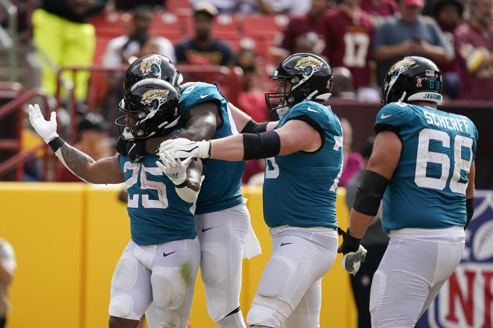Jacksonville Jaguars running back James Robinson (25) celebrates his touchdown against the Washington Commanders during the second half of an NFL football game, Sunday, Sept. 11, 2022, in Landover, Md. (AP Photo/Alex Brandon)