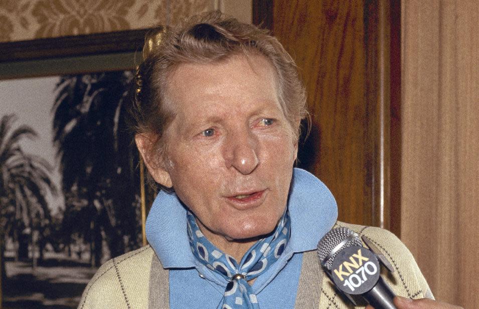 FILE - In this Sept. 27, 1983 file photo, entertainer Danny Kaye is interviewed by the media in Pasadena, Calif. In the 100th year of his birth, Dena Kaye is determined to help a new generation discover the genius, and the generosity, of her father, who died in 1987 at age 74. Danny Kaye is now on Facebook with an official page. His official Website has been relaunched with plenty of multimedia. The Library of Congress unveiled its new Danny and Sylvia Fine Archive, where countless documents, including video, audio and photographs from Dena's parents' own collection, are available for examination on the Internet. (AP Photo/Wally Fong)