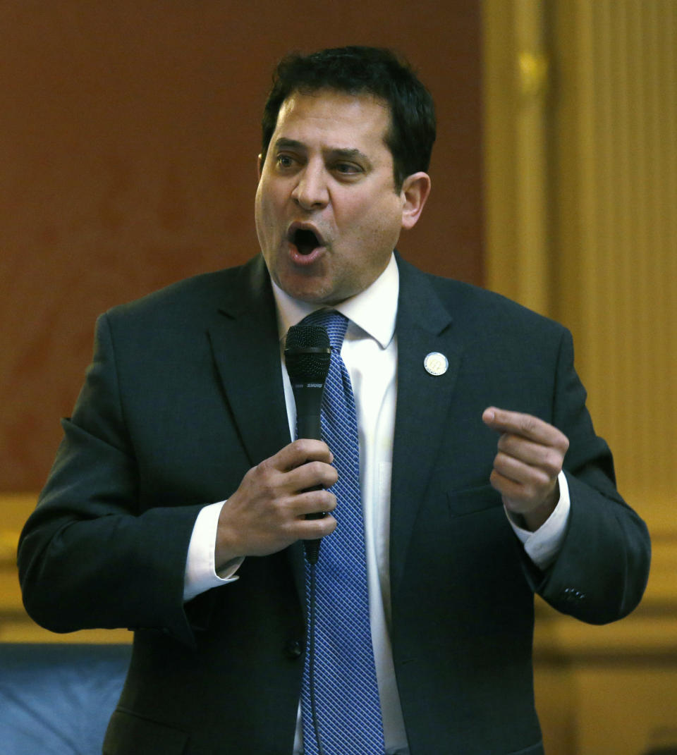 FILE This Monday Feb. 10, 2020 file photo shows Del. Mark Levine, D-Alexandria presents HB961, his bill dealing with the banning of assault weapons and extended magazines during the floor session of the Virginia House of Delegates in Richmond, Va. In a state once synonymous with the Old South, Democrats are using their newfound legislative control to refashion Virginia as the region's progressive leader on racial, social and economic issues. (Bob Brown/Richmond Times-Dispatch via AP)