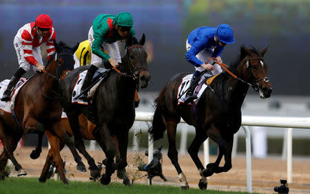 Horse Racing - Dubai World Cup - Meydan Racecourse, Dubai - 25/3/17 - Christophe Soumillon rides Vazirabad to the finish line to win the third race. REUTERS/Ahmed Jadallah