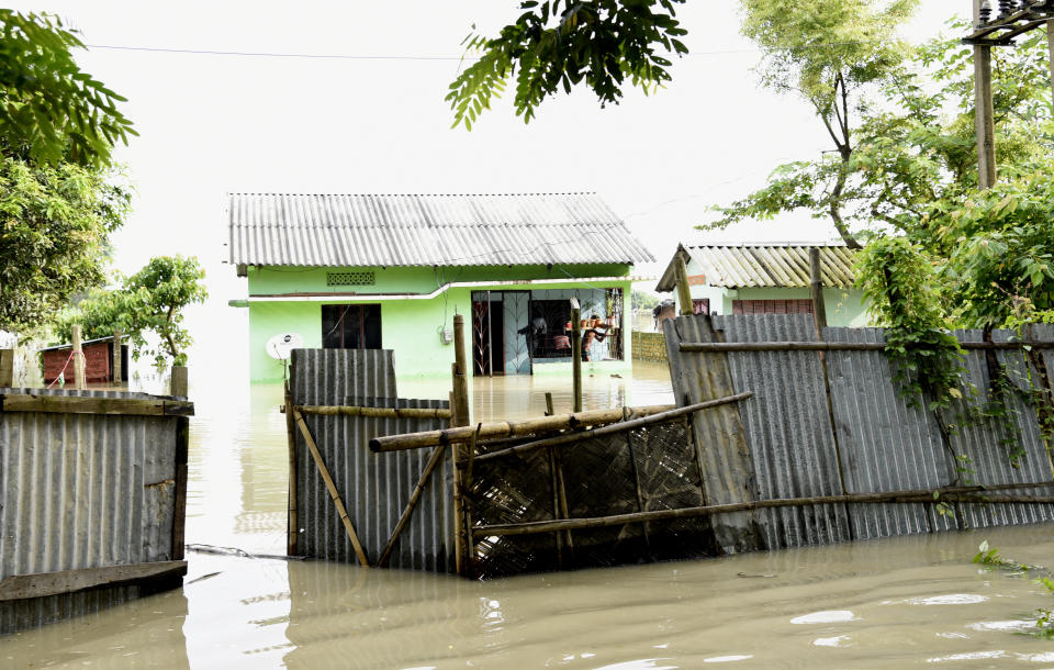 A house partially submerged by flood water, in Panikhaiti village, in Kamrup District, Assam, India on Tuesday, on July 14, 2020. Villages in Assam were flooded due to heavy rains. The rising water level inundated houses, residents were forced to move to a safer place. (Photo by Hafiz Ahmed/Anadolu Agency via Getty Images)