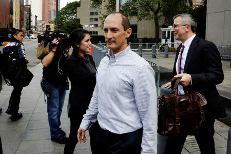 Rob Olan (C), employee of the healthcare investment fund Deerfield Management, departs Federal Court in Manhattan after an arraignment for insider trading in New York, U.S., May 24, 2017. REUTERS/Lucas Jackson