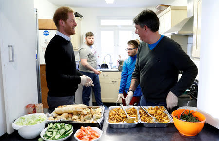 Britain's Prince Harry meets staff and volunteers preparing a lunch during his visit to a 'Fit and Fed' half-term initiative in London, Britain February 19, 2019. Chris Jackson/Pool via REUTERS