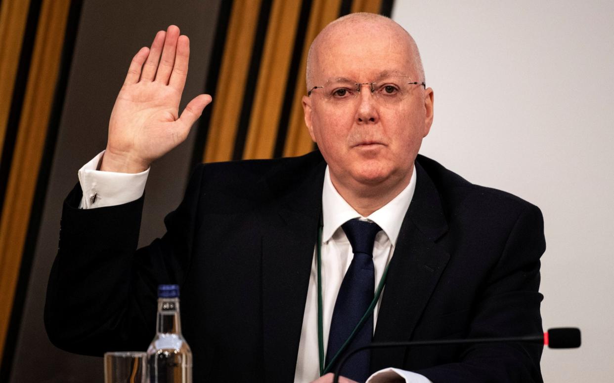 Peter Murrell takes his oath ahead of giving evidence in the Scottish Parliament -  POOL/Reuters