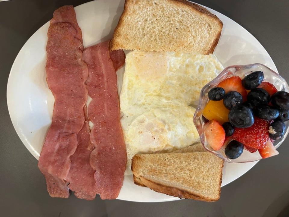Turkey bacon, over-easy eggs, toast and fruit from Eggs Up Grill, 2951 Town Center Drive in Hope Mills.