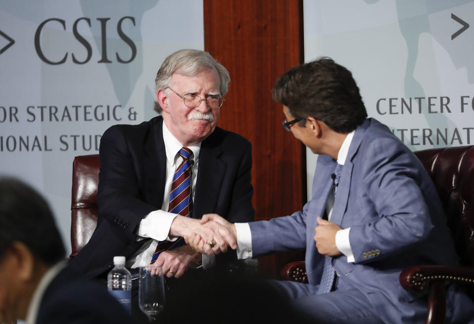 Former National security adviser John Bolton, left, shakes hands with Dr. Victor D. Cha, right, Senior Adviser and Korea Chair, CSIS; Professor and Vice Dean, Georgetown at the Center for Strategic and International Studies (CSIS) in Washington, Monday, Sept. 30, 2019. (AP Photo/Pablo Martinez Monsivais)