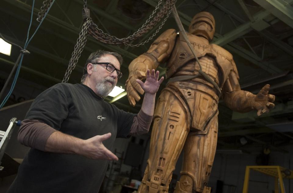 Giorgio Gikas, president of Venus Bronze Works, talks about a foam model of the the fictional crime-fighting cyborg RoboCop statue inside Venus Bronze Works in Detroit , Michigan on Tuesdat, Sept. 24, 2013. Venus Bronze Works in Detroit is getting ready to cast pieces of the statue. After this model is turned into a mold, the finished statue is set to be unveiled in summer of 2014. The 1980s science fiction movie was set in a futuristic and crime-ridden Detroit. (AP Photo/The Detroit News, David Guralnick )