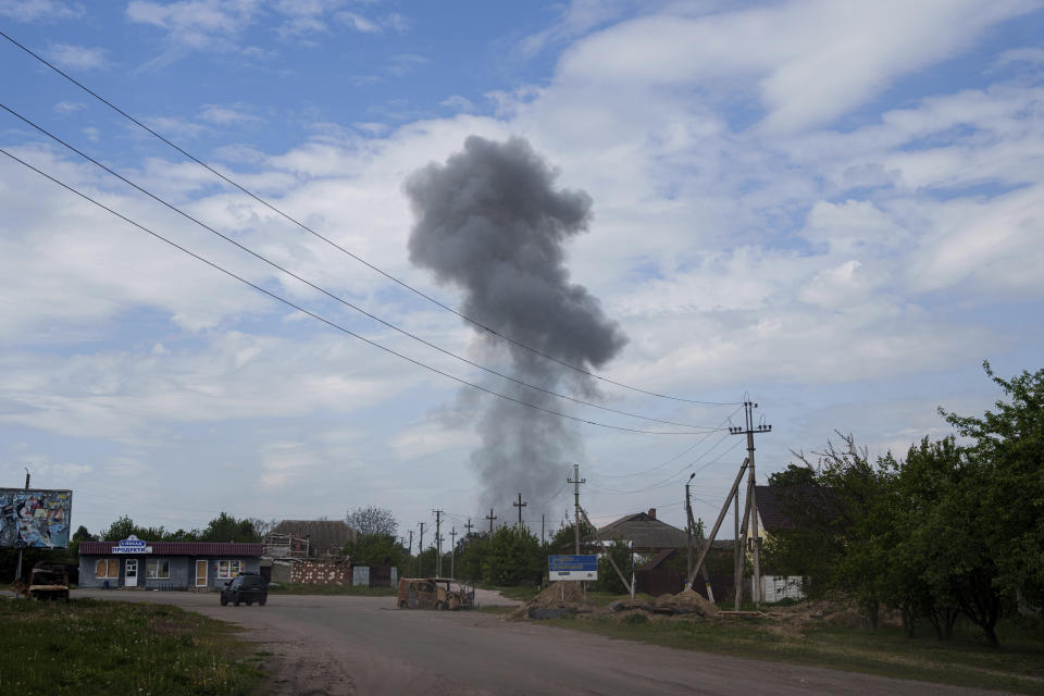 Smoke rises over the houses after a Russian airstrike on a residential neighbourhood in Vovchansk, Ukraine, on Saturday, May 11, 2024. (AP Photo/Evgeniy Maloletka)