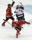 Canada's Connor McDavid (17) celebrates his goal with teammate Sam Reinhart (23) in front of United States' Ian McCoshen (3) during the third period of their IIHF World Junior Championship ice hockey game in Malmo, Sweden, December 31, 2013. REUTERS/Alexander Demianchuk (SWEDEN - Tags: SPORT ICE HOCKEY)