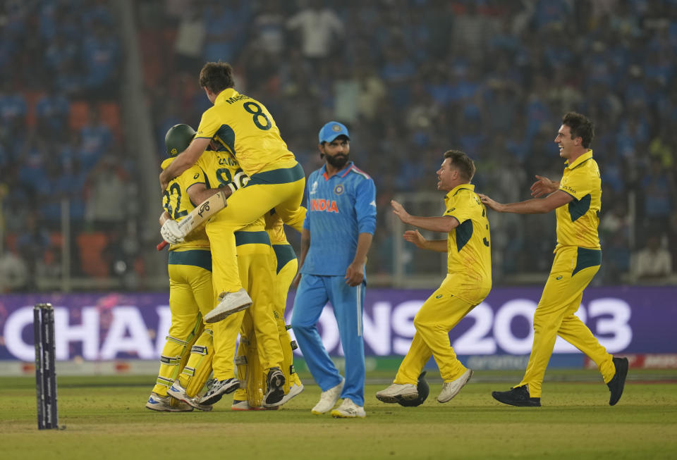 Australia players celebrate after wining against India by 6 wickets during the ICC Men's Cricket World Cup final match in Ahmedabad, India, Sunday, Nov.19, 2023. (AP Photo/Aijaz Rahi)