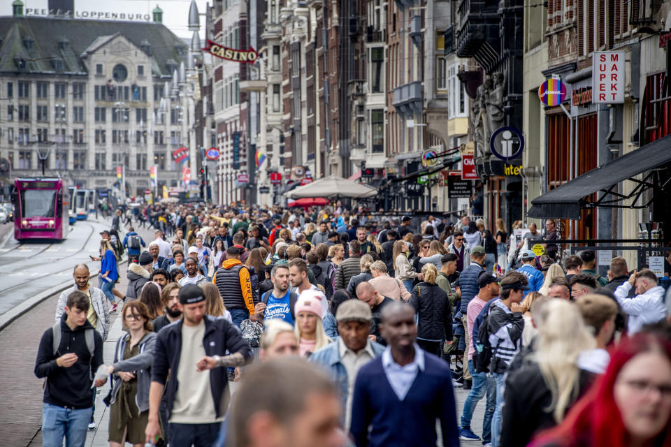 AMSTERDAM, NETHERLANDS - 2020/07/25: The tram area full with people. Crowded with tourists shopping on the streets and the Dam full of visitors with one-way traffic in the Kalverstraat, one tries to keep one and a half meters away but it is difficult amid the coronavirus threats. (Photo by Robin Utrecht/SOPA Images/LightRocket via Getty Images)