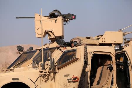 U.S. military vehicles are seen in the town of Bashiqa, east of Mosul, during an operation to attack Islamic State militants in Mosul, Iraq, November 7, 2016. REUTERS/Azad Lashkari