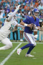 Miami Dolphins outside linebacker Jaelan Phillips (15) sacks New York Giants quarterback Mike Glennon (2) during the second half of an NFL football game, Sunday, Dec. 5, 2021, in Miami Gardens, Fla. (AP Photo/Lynne Sladky)