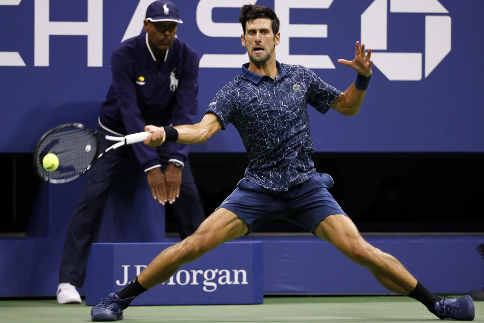 Novak Djokovic, of Serbia, returns a shot to Richard Gasquet, of France, during the third round of the U.S. Open tennis tournament, Saturday, Sept. 1, 2018, in New York. (AP Photo/Adam Hunger)