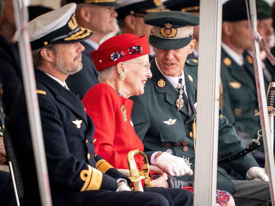 Queen Margrethe flanked by Prince Frederik and Prince Joachim  as she attends festivities of the Danish Army to celebrate her 50th regency jubilee.