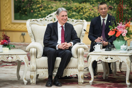 Britain's Chancellor of the Exchequer Philip Hammonds talks with and China's Premier Li Keqian (not pictured) at the Great Hall of the People in Beijing, China December 15, 2017. REUTERS/Fred Dufour/Pool