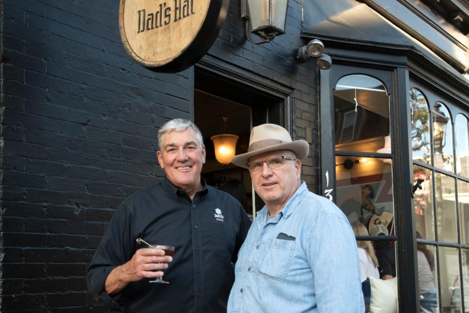 Owners John Cooper, left, and Herman Mihalich pose for a portrait in front of Dad's Hat on Mill Street in Bristol while hosting its soft opening on Wednesday, May 11, 2022.