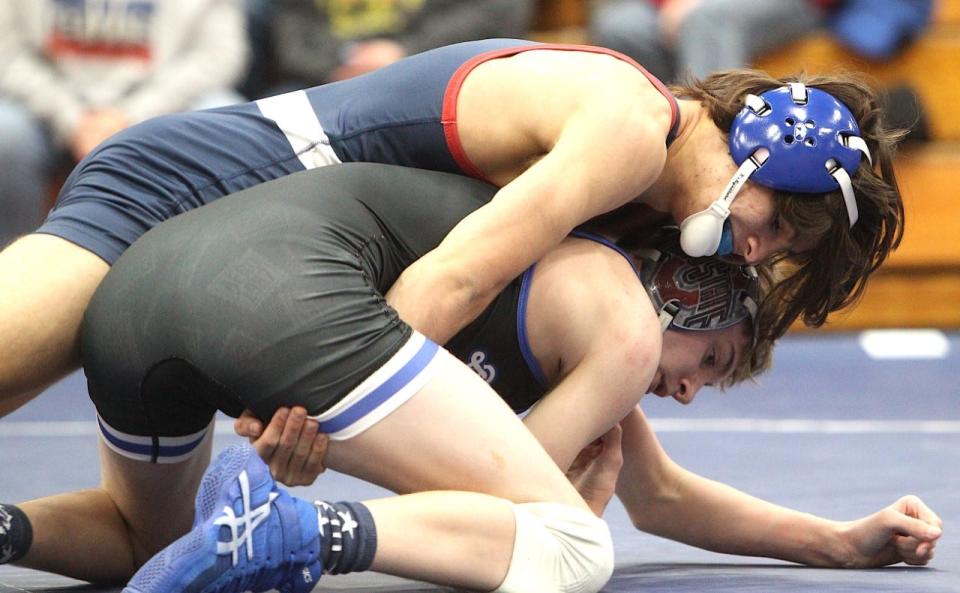 BNL sophomore Jorj Filler (top) works a hold en route to a 5-2 decision over Columbus North's Joseph Cloud at 120 pounds Thursday night.