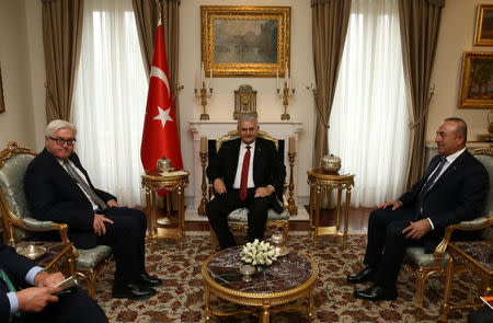 Turkish Prime Minister Binali Yildirim, accompanied by Foreign Minister Mevlut Cavusoglu, meets with German Foreign Minister Frank-Walter Steinmeier in Ankara, Turkey November 15, 2016. Hakan Goktepe/Prime Minister's Press Office/Handout via REUTERS