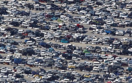 Cars crushed by the March 11 earthquake and tsunami are seen in Ishinomaki, Miyagi prefecture, in this September 7, 2011 file photo. REUTERS/Issei Kato/Files