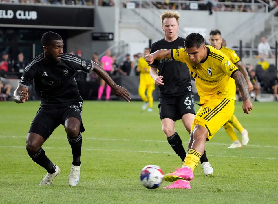 Jun 24, 2023; Columbus, Ohio, USA; Columbus Crew forward Cucho Hernandez (9) takes the shot against Nashville SC defender Shaq Moore (18) in the second half during their MLS game at Lower.com Field. 