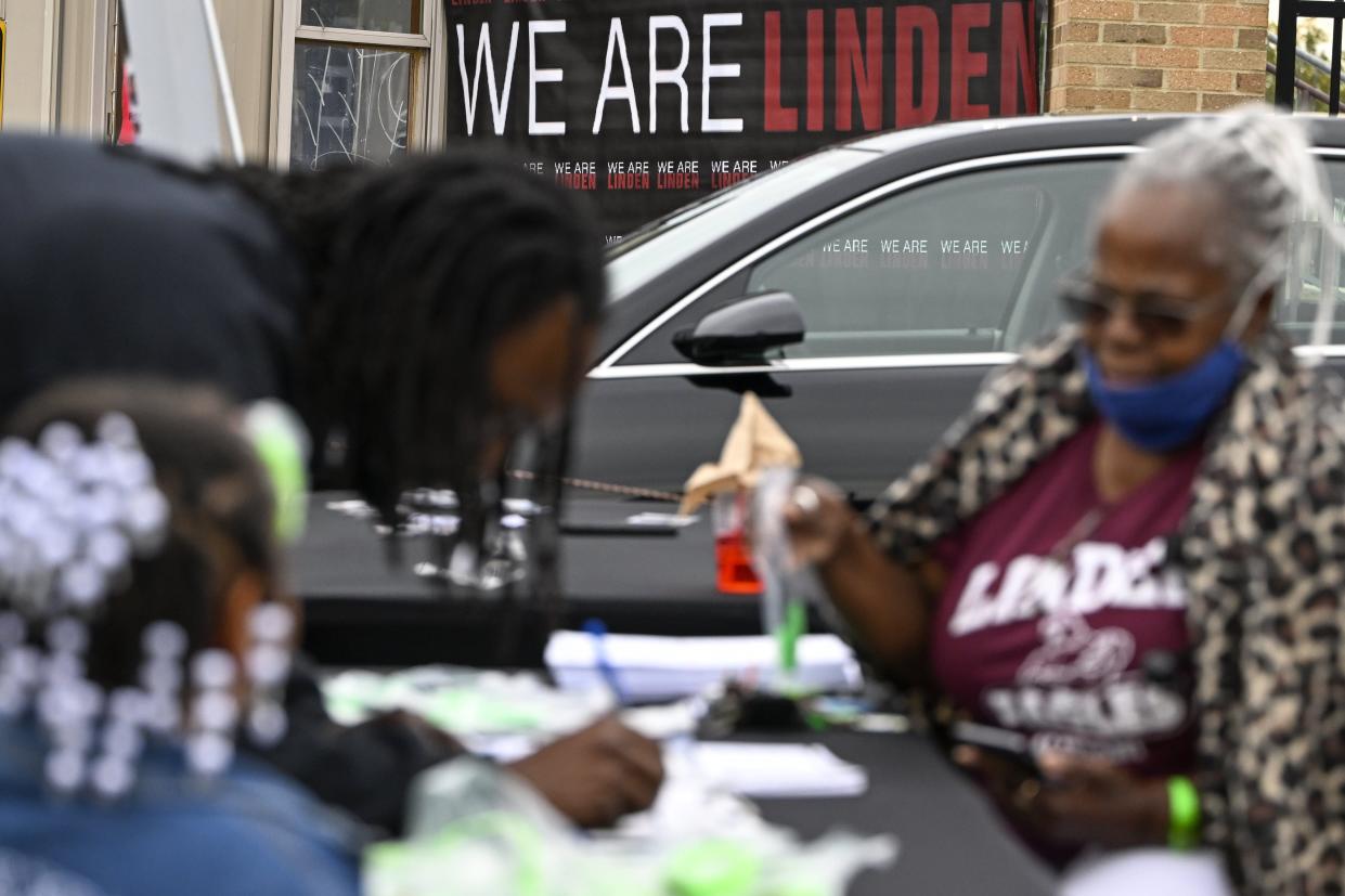 Community members, alumni and students of Linden-McKinley High School take part in a tailgate before the homecoming football game against Centennial High School.