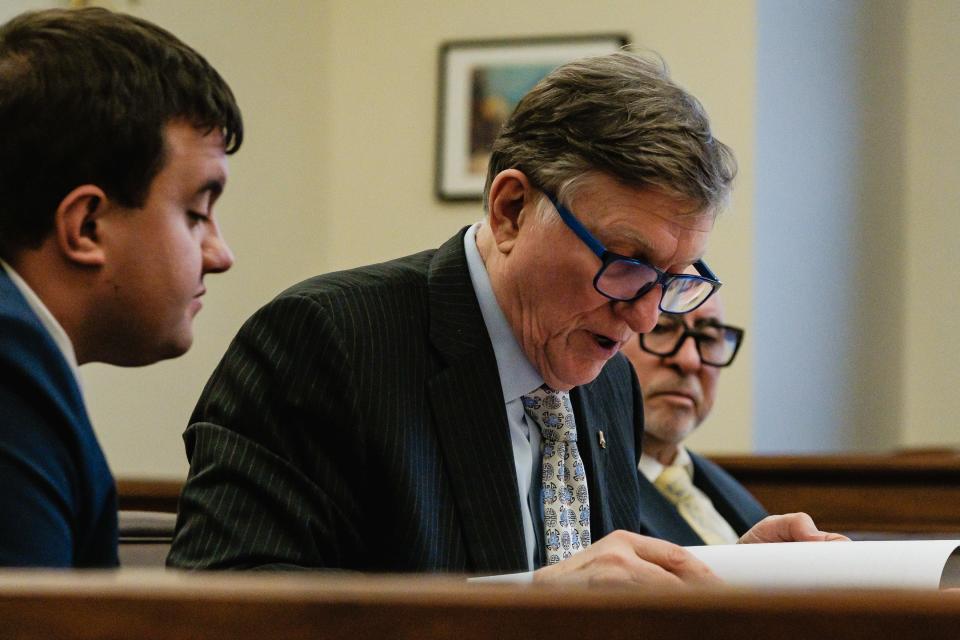 Justin D. McCauley, left, appears in a final pretrial hearing along with his attorneys, Thomas A. Pavlinic, middle, and Christopher P. Delacruz before Judge Michael Ernest in the Tuscarawas County Court of Common Pleas.