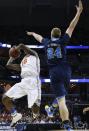 Florida forward Dorian Finney-Smith (10) shoots against UCLA forward Travis Wear (24) during the first half in a regional semifinal game at the NCAA college basketball tournament, Thursday, March 27, 2014, in Memphis, Tenn. (AP Photo/Mark Humphrey)