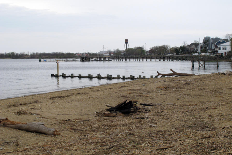 This Tuesday, April 19, 2021 photo shows the waterfront of Raritan Bay in Keyport, N.J. A Massachusetts company wants to build a high-voltage power line that would come ashore in Keyport and connect electricity from a future wind farm off the New Jersey coast to the onshore electrical grid. (AP Photo/Wayne Parry)