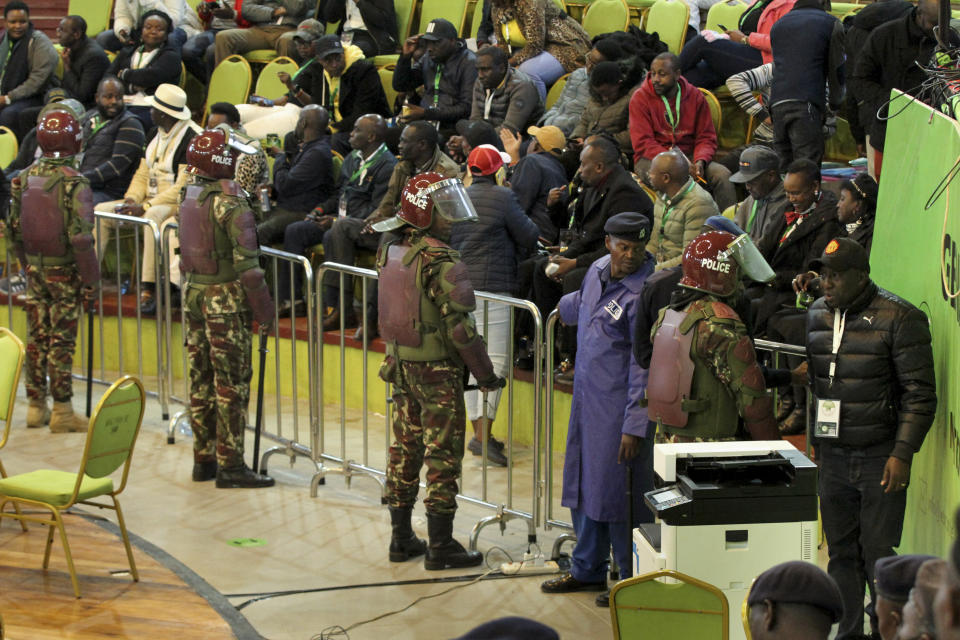 Riot police are deployed to provide security after scuffles broke out between political party agents and police at the electoral commission's national tallying center in Nairobi, Kenya, late night Saturday, Aug. 13, 2022. Kenya's peaceful presidential election saw a brief disruption late Saturday when police responded to scuffles at the national tallying center amid tensions over the close results. (AP Photo)