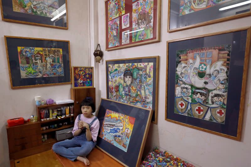 A Vietnamese school girl draws paintings about the coronavirus disease (COVID-19) in Hanoi