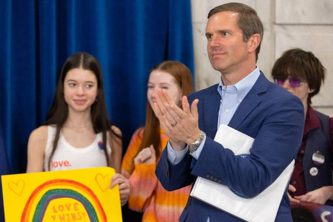 Kentucky Gov. Andy Beshear applauds during a LGBTQ rally in the rotunda at the Kentucky state Capitol in Frankfort, Ky., on Wednesday, Feb. 21, 2024.