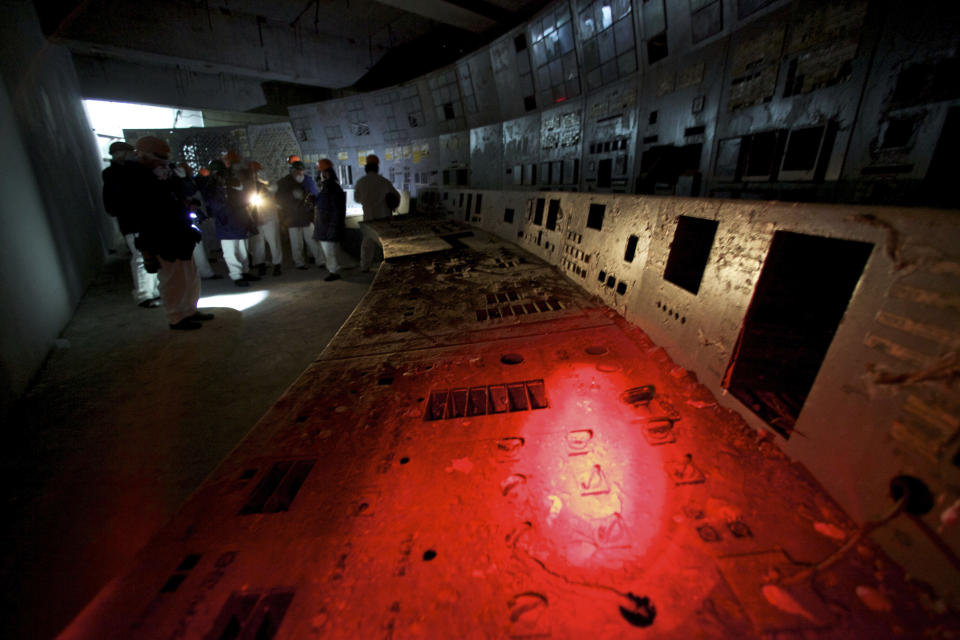 FILE - In this Thursday Feb. 24, 2011 file photo, the shattered remains of the control room for Reactor No. 4 seen at the Chernobyl nuclear power plant in Ukraine. The vast and empty Chernobyl Exclusion Zone around the site of the world’s worst nuclear accident is a baleful monument to human mistakes. Yet 35 years after a power plant reactor exploded, Ukrainians also look to it for inspiration, solace and income. (AP Photo/Alexander Zemlianichenko, file)