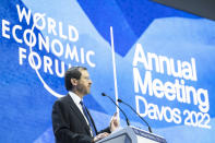 Isaac Herzog, President of the State of Israel, left, delivers a speech at the 51st annual meeting of the World Economic Forum, WEF, in Davos, Switzerland, on Wednesday, May 25, 2022. The forum has been postponed due to the Covid-19 outbreak and was rescheduled to early summer. The meeting brings together entrepreneurs, scientists, corporate and political leaders in Davos under the topic "History at a Turning Point: Government Policies and Business Strategies" from 22 - 26 May 2022. (Gian Ehrenzeller/Keystone via AP)