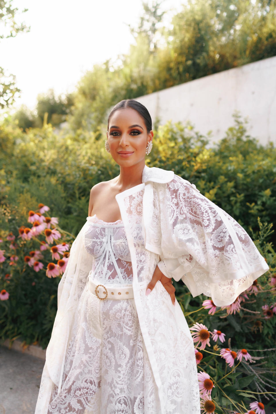 jessel taank smiles in a white lace outfit