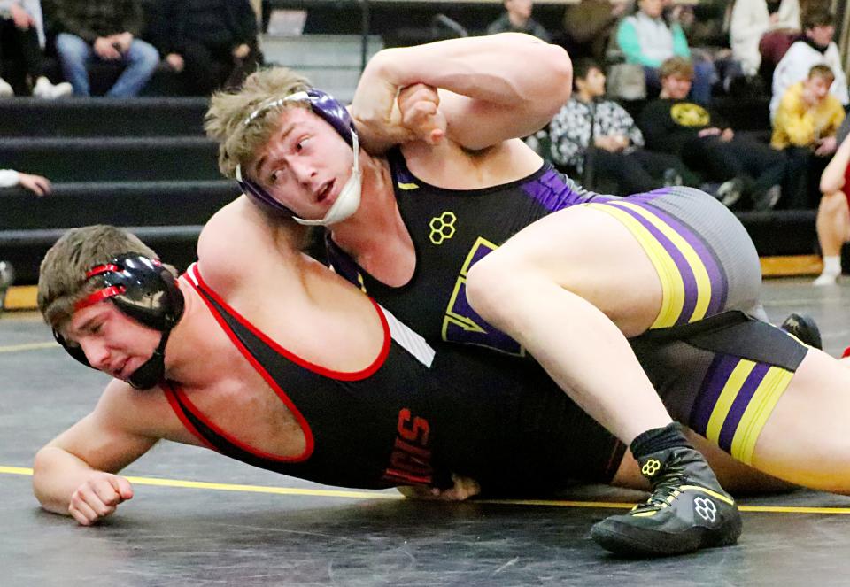 Watertown's Draven Bau works to turn Sturgis' Zak Juelfs during their 220-pound championship match Saturday in the Jerry Opbroek Invitational wrestling tournament at Mitchell. Bau won by fall and was one of three Arrows to win individual titles in the tourney.