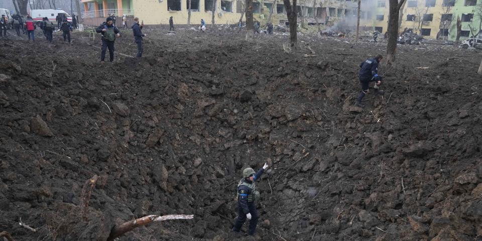 A crater caused by Russian bombing outside the maternity hospital in Mariupol, Ukraine.