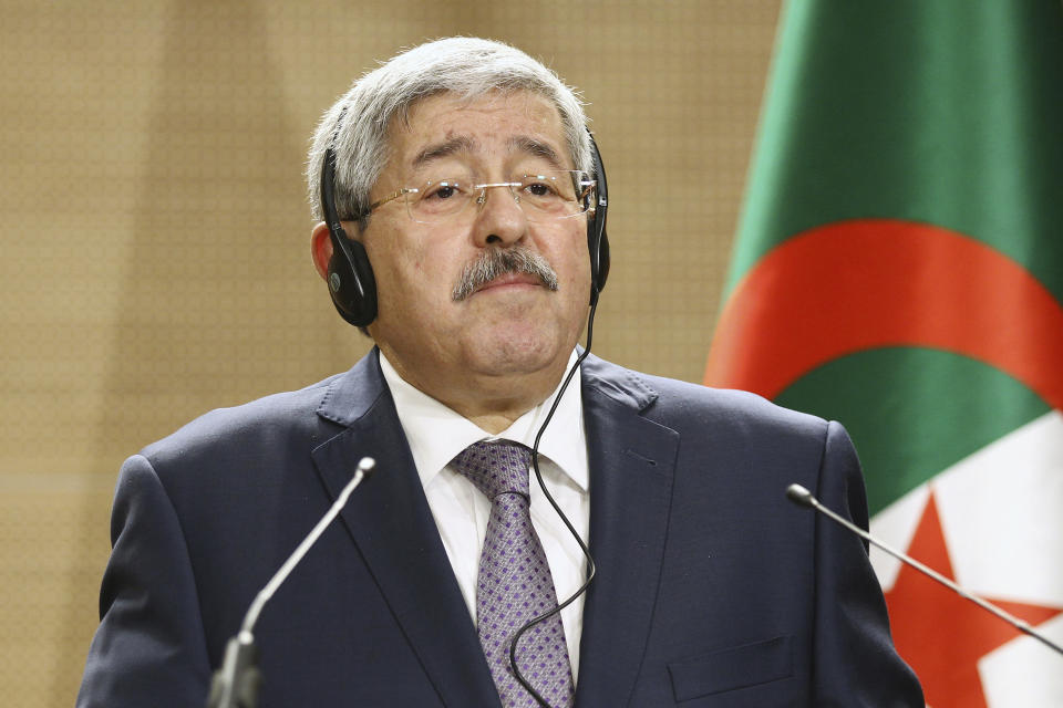 FILE - In this Sept. 17, 2018 file photo, former Algerian Prime Minister Ahmed Ouyahia listens to a question during a press conference in Algiers. Two former Algerian prime ministers have been convicted and sentenced to prison for corruption-related charges in a landmark trial. Ahmed Ouyahia was sentenced to 15 years in prison and $16,000 in fines. (AP Photo/Anis Belghoul, file)