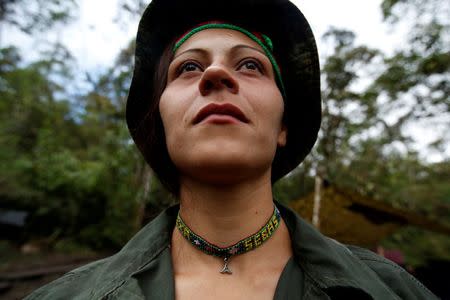 Alexandra, a member of the 51st Front of the Revolutionary Armed Forces of Colombia (FARC), poses for a picture at a camp in Cordillera Oriental, Colombia, August 16, 2016. REUTERS/John Vizcaino