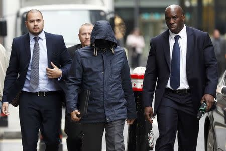 Former undercover reporter for the News of the World and the Sun on Sunday, Mazher Mahmood (C), arrives at the Old Bailey, in London, Britain September 19, 2016. REUTERS/Stefan Wermuth