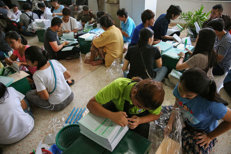 Bangkok district officers prepare ballot boxes and other documents ahead of the general election at a local district office in Bangkok, Thailand, March 23, 2019. REUTERS/Athit Perawongmetha