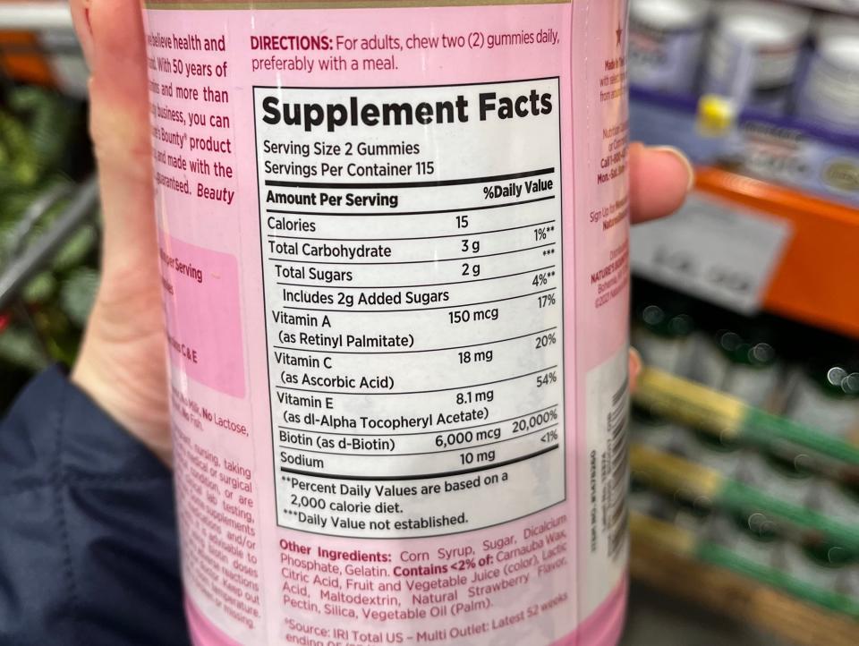 supplement facts label on a bottle the writer is holding