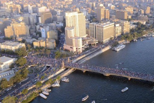 A Egyptian army picture shows people crossing the Nile River to Cairo's Tahrir Square on Friday. At least 72 people were killed during clashes in Cairo on Saturday, Egypt's health ministry said, after violence erupted at a demonstration in support of ousted president Mohamed Morsi