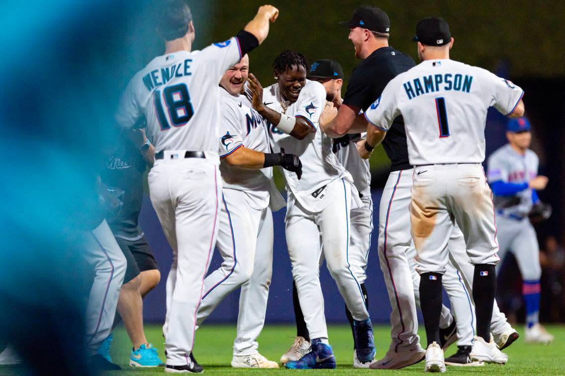 Miami Marlins third baseman Jake Burger (36) reacts with teammates after hitting a walk-off single to defeat the New York Mets 4-3 during the ninth inning of an MLB game against the New York Mets at loanDepot park in the Little Havana neighborhood of Miami, Florida, on Tuesday, September 19, 2023.