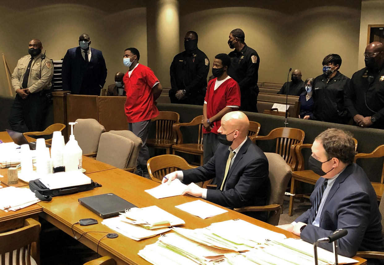 FILE - From left, Justin Johnson and Cornelius Smith appear before a judge during a court hearing related to the fatal shooting of rapper Young Dolph on Friday, Feb. 11, 2022, in Memphis, Tenn. (AP Photo/Adrian Sainz, File).