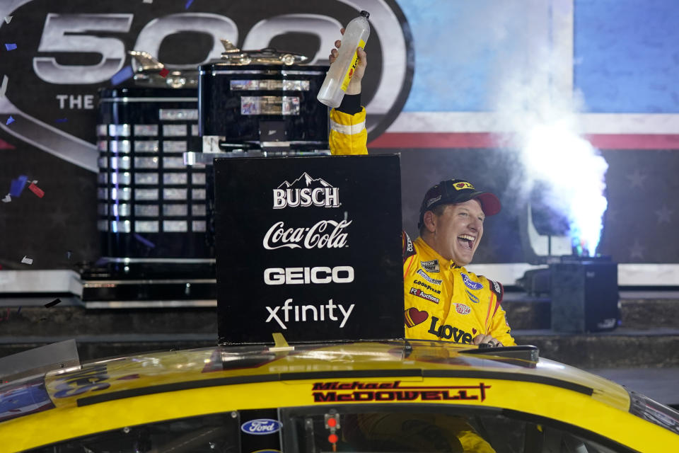 Michael McDowell celebrates after winning the NASCAR Daytona 500 auto race at Daytona International Speedway, Monday, Feb. 15, 2021, in Daytona Beach, Fla. (AP Photo/John Raoux)