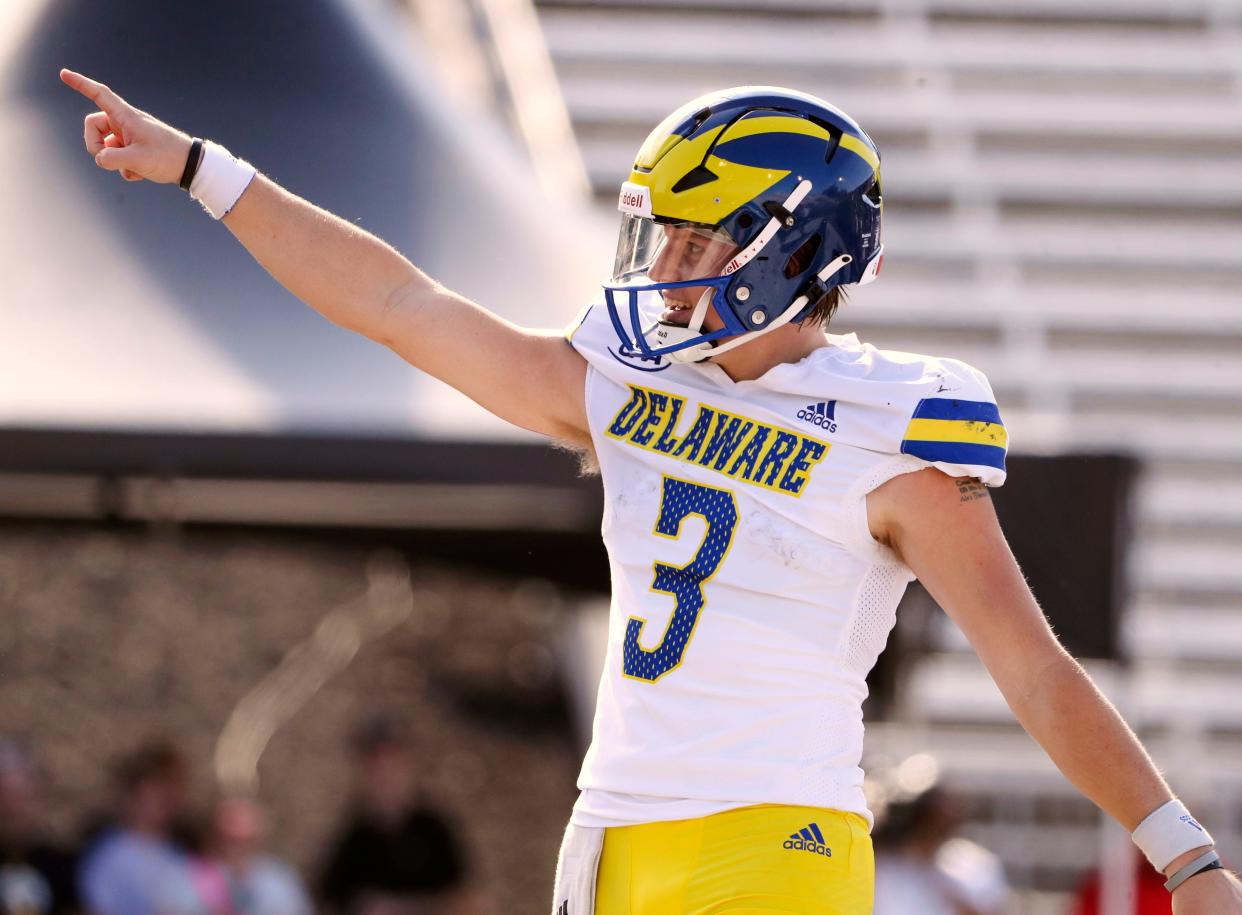 Delaware quarterback Zach Marker celebrates a second quarter touchdown pass against Towson at Johnny Unitas Stadium in Towson, Md., Saturday, Oct. 28, 2023.