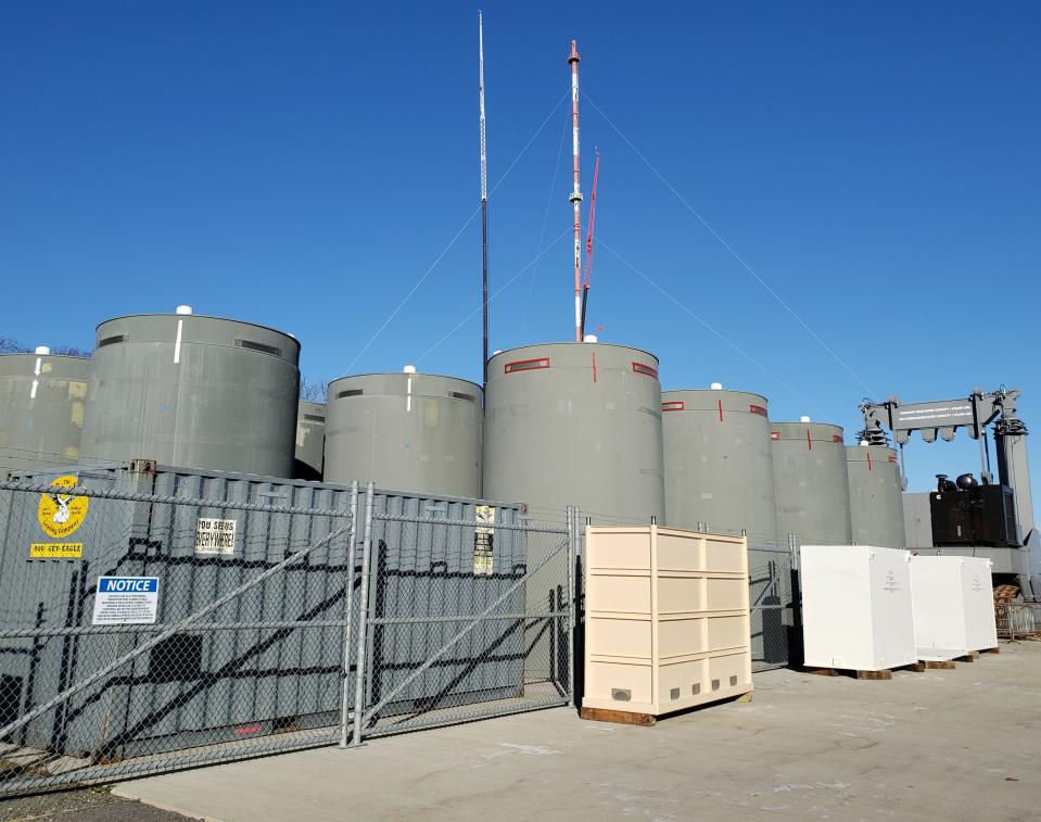 Dry casks hold spent fuel rods in storage on a pad at the closed Pilgrim Nuclear Power Station in Plymouth in December of 2020.